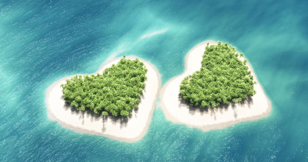 Airplane-above-the-second-heart-shaped-tropical-island-617877848_4000x1449—Relat